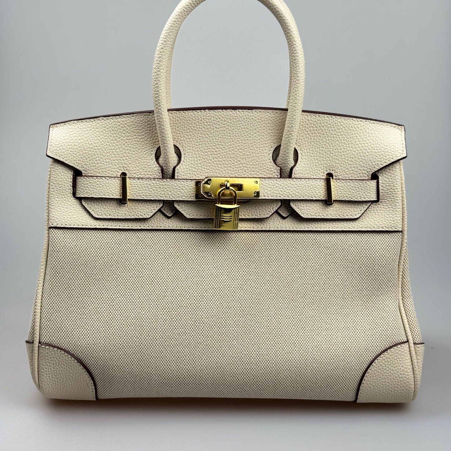 Mala Estilo Birkin em Tela e Pele Genuína – Luxo Estruturado com Fecho Elegante