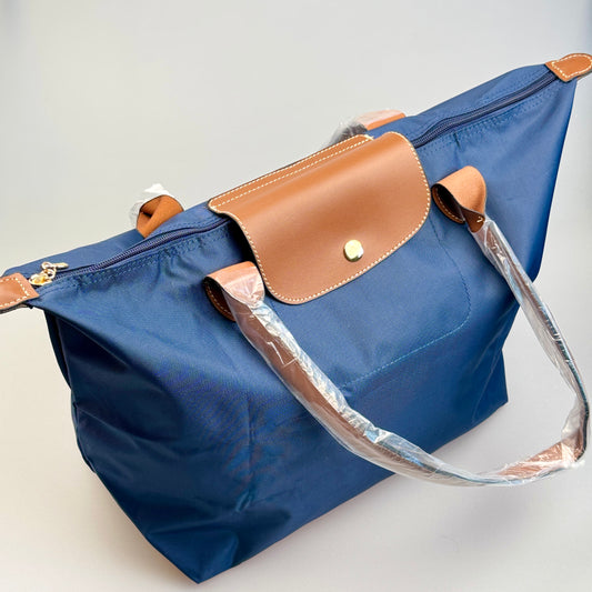 Mala Dobrável Parisienne – Nylon Resistente e Alças em Pele Sintética