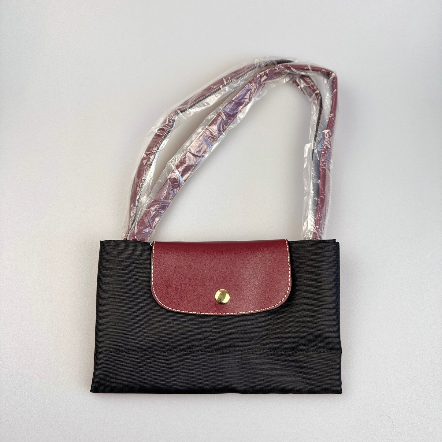 Mala Dobrável Parisienne – Nylon Resistente e Alças em Pele Sintética